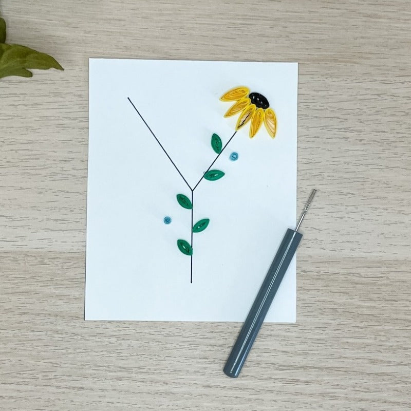 Alphabet Y decorated with paper quilling sunflower and leaves.